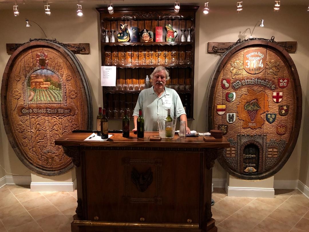 The Bolinger gallery and tasting room with carved wine cask ends displayed on the walls